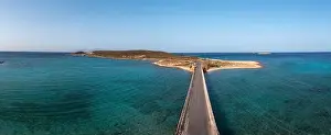 Greece. Aerial panoramic view over Kythira Diakofti bridge going to island harbor, blue sky and sea, sunny summer day