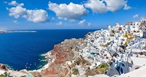 Images Dated 25th July 2021: Greek island of Santorini. Amazing travel panorama, white houses, stairs and flowers on the streets