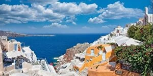 Images Dated 25th July 2021: Greek island of Santorini. Amazing travel panorama, white houses, stairs and flowers on the streets