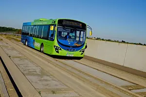 Routes Prints: green bus on busway road, cambridge biomedical campus, england