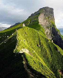 Hike Prints: Green faroese hills and Kallur lighthouse on mountains of Kalsoy island