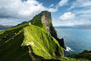Green faroese hills and Kallur lighthouse on mountains of Kalsoy island, Faroe islands, Denmark. Landscape photography
