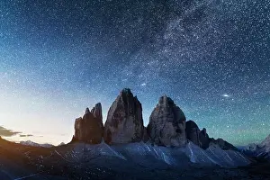 Camp Prints: Green tent lighted from the inside against the backdrop of incredible starry sky and Three Peaks of Lavaredo mountains