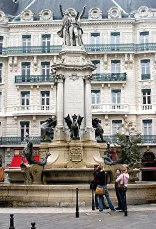 Dragon Prints: GRENOBLE, FRANCE - SEPTEMBER 10: Fountain of the Three Orders Monument in place Notre Dame on September 10