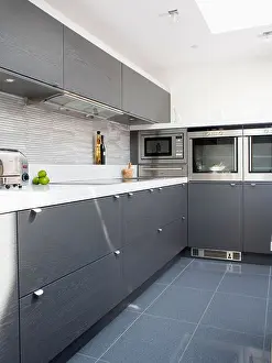Floors Prints: Grey ceramic floor tiles in modern white kitchen with dark gray fitted cupboards and units