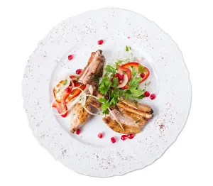 Rack Prints: Grilled lamb racks in eastern style with fresh vegetables and pomegranate seeds