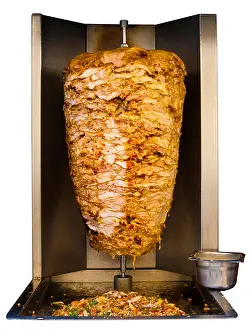 Turning Prints: Grilled skewered chicken, a traditional meat served inside a shawarma sandwich in the Arab countries in Middle East