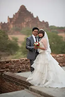 Heterosexual Couple Prints: A groom and bride in a temple of Bagan, Myanmar