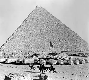 Caravan Prints: A group of American Airstream Trailers on a caravan gather at the Pyramids at Giza near Cairo in Egypt