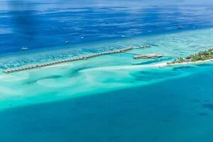 Images Dated 19th April 2016: Group of atolls and islands in Maldives from aerial view. Beautiful Maldives landscape, blue sea