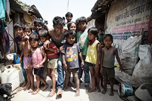 Dump Prints: Group of children in the slum at the Ghazipur garbage dump, New Delhi, India