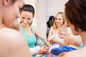 Supportive Prints: Group exercise class, mother working out with baby in gym