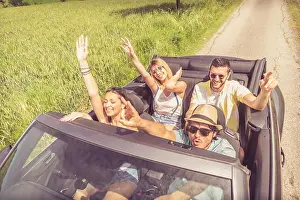 Convertible Prints: Group of friends having fun at car trip
