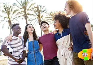 Holiday Maker Prints: Group of five happy young people standing outside together on summer vacation