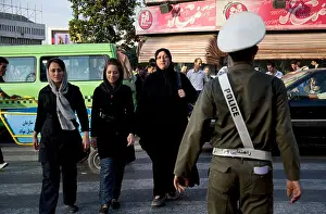 Veil Prints: Group of Iranian women and girls crossing the street in Rasht