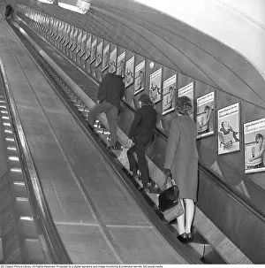 Escalator Prints: A group of people ascends the escalator at Fridhemsplan metro station in Stockholm