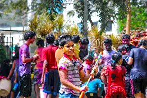Hindu Festival Prints: Group of people playing with powder colors & water during the spring hindu festival Holi also known as a festival of