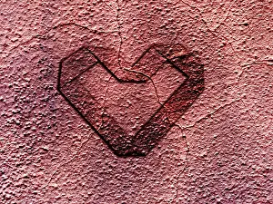 Grunge heart embossed on rusty metal surface - Valentine concept