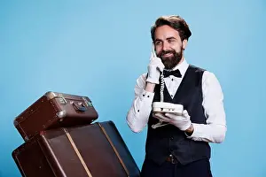 Offering Prints: Guests call at hotel reception on landline phone