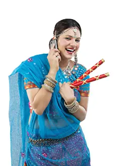 Asians Prints: Gujarati woman talking on a mobile phone