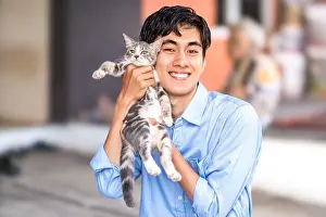 Cuddle Prints: a guy smiling while hugging his cat. Handsome men and a cute kitten
