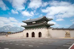 Gyeongbokgung palace gate and wall with nice sky in morning landmark of Seoul, South Korea. Asian tourism, history building, or tradition culture