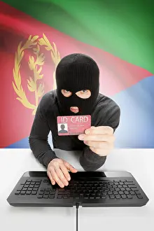Hacker Prints: Hacker with ID card in hand and flag on background - Eritrea