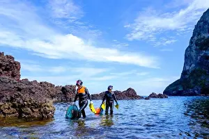 Haenyeo women, famous for diving into their eighties and holding their breath for up to two minutes, diving for conch, octopus, seaweed, and other sea