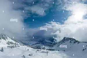 Snowboard Prints: hahnenkamm ski area in tyrol with a view of the deep wintry town of reutte
