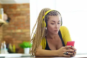 Braids Prints: Hairstyle and fashion. Woman with yellow dreadlocks