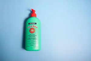 Illustrative Editorial Prints: Halifax, Canada - April 11, 2020: A green bottle of Gold Bond brand medicated hand lotion