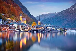 Mountain Ridge Prints: Hallstatt, Austria. Cityscape image of iconic alpine village Hallstatt at dramatic autumn sunset