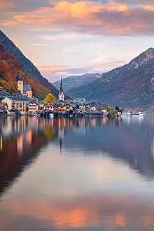 Hallstatt, Austria. Cityscape image of iconic alpine village Hallstatt at dramatic autumn sunset