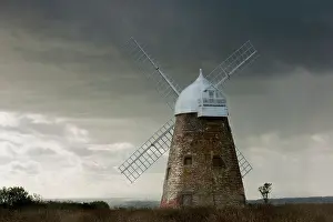 Windmills Prints: Halnaker Windmill after a storm on the South Downs with a view of Chichester Cathedral spire in West Sussex England UK