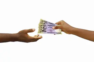 Black Hand Prints: Hand giving 1000 Bangladeshi taka notes to another hand. Hand receiving money
