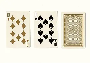 Pastime Prints: A hand of vintage playing cards in sepia with a pair of tens revealed on a cream background