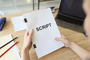 Backstage Prints: Hands of woman holding script papers for movie in hands