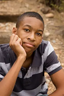 Good Looking Prints: Handsome African-American Male sitting in an outdoor setting