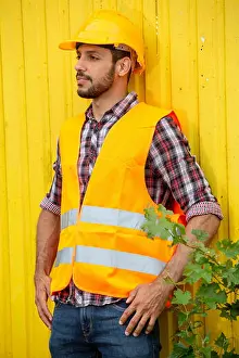 Foreman Prints: handsome construction worker with yellow helmet and orange vest