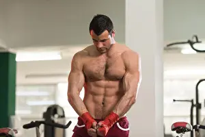 Bodybuilding Prints: Handsome Man In Red Boxing Gloves - Boxing In Gym - The Concept Of A Healthy Lifestyle - The Idea For The Film About
