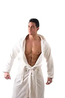Gown Prints: Handsome muscular young man wearing white bathrobe, isolated