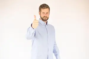 Brilliant Prints: handsome young man in blue shirt giving thumbs up