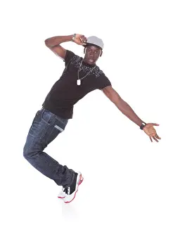 Moves Prints: Happy African Young Man Dancing Over White Background