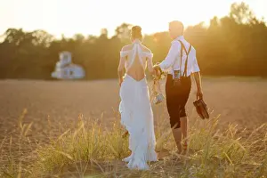 Tuxedo Prints: Happy bride and groom on a beautiful beach on sunset