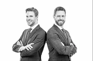 Advisor Prints: two happy business leaders in suit cross hands isolated on white, leadership