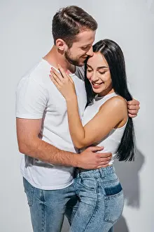 Kissing Prints: happy couple of two people in love smiling while hugging each other