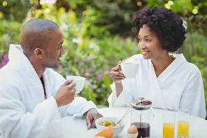Domicile Prints: Happy couple taking breakfast in the garden