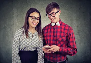 Upgrade Prints: Happy eccentic hipster guy holding smart phone
