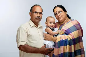 Baby Girl Prints: Happy Indian Family, grand parents and baby girl, isolated on white background