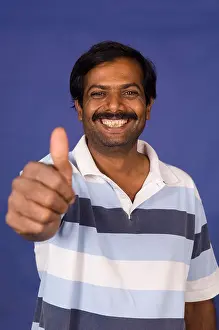 Approval Prints: Happy Indian man thumbs up